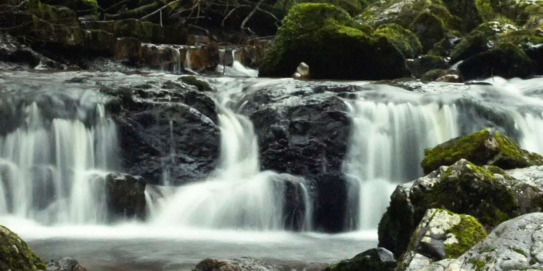 Beautiful natural river in the Scottish Highlands on a cold and misty winter morning